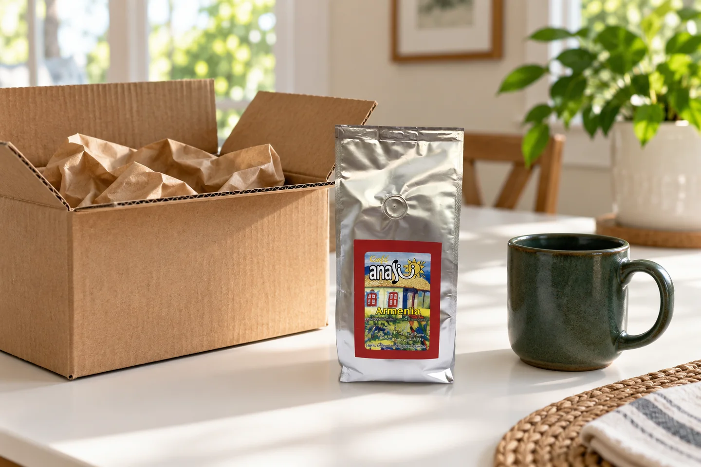 ANASU Armenia coffee bag beside a plain delivery carton and a ceramic mug