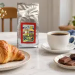 ANASU Armenia coffee bag with a cup of black coffee, a pastry and pieces of chocolate