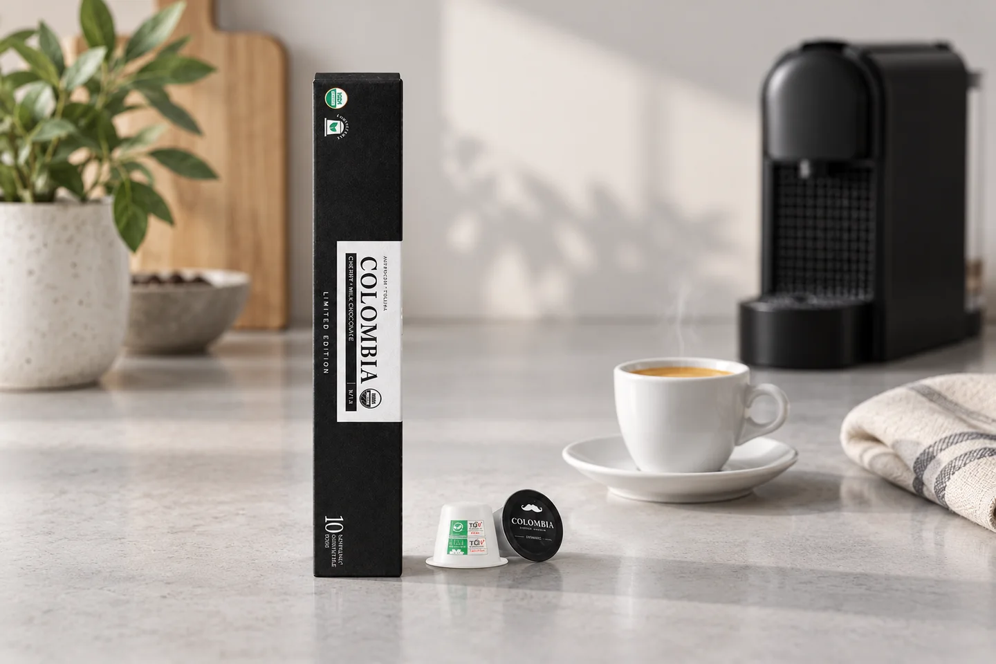 Colombia espresso capsule carton and Original-format capsules beside a demitasse