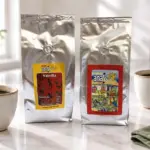 ANASU Vanilla and Armenia coffee bags beside cups, milk and a green napkin