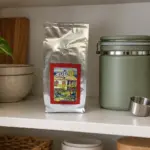 ANASU Armenia bag and closed opaque coffee canister on a dry pantry shelf